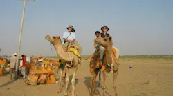 Peter Morgan riding a camel in India in 2006 Peter Morgan riding a camel in India in 2006