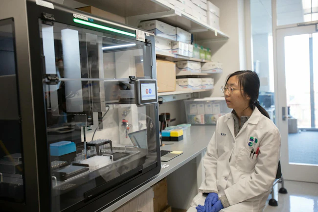 Opentrons Flex Boston researcher observing an automated experiement