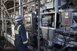 Engineer at Pyroban examining factory equipment Engineer at Pyroban examining factory equipment