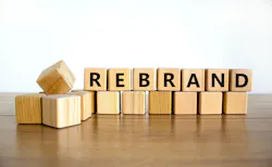 The concept word Rebrand on wooden cubes. The concept word Rebrand on wooden cubes.
