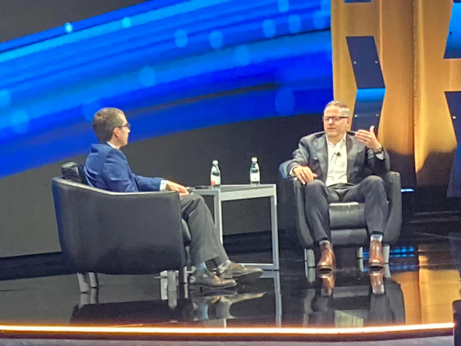 Dylan Pugh, engineering VP at ExxonMobil (right), described to Vincent Servello, president of AspenTech (left), how it&rsquo;s using digitalization and AI in its operations during the May 11 opening keynote and chat kicking off Optimize 26 in Houston.