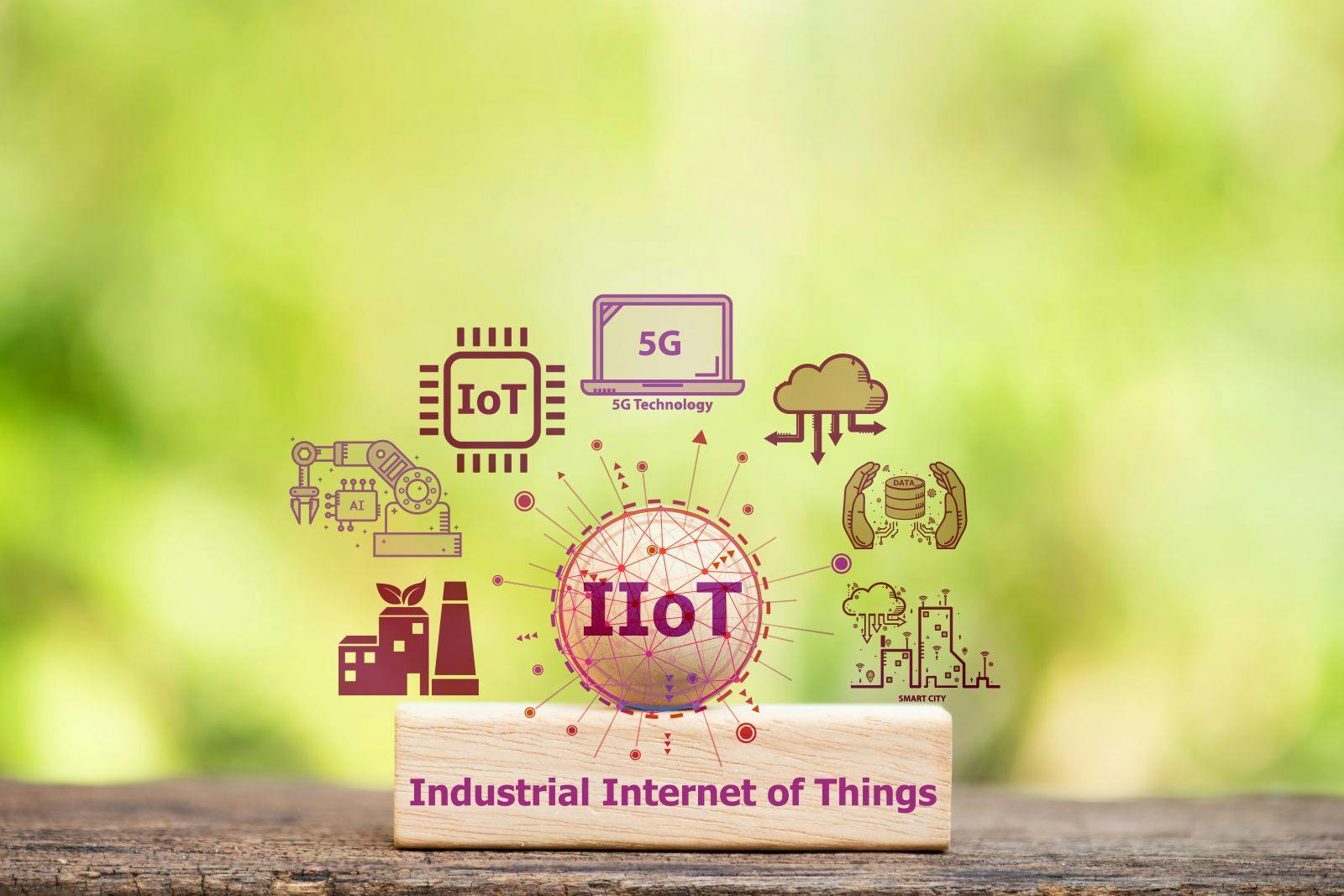 IIoT or Industrial Internet of Things text on woods and icons on natural background.