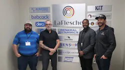 ABB and LaFlesche employees standing in front of a wall of channel-partner collaborators. ABB and LaFlesche employees standing in front of a wall of channel-partner collaborators.