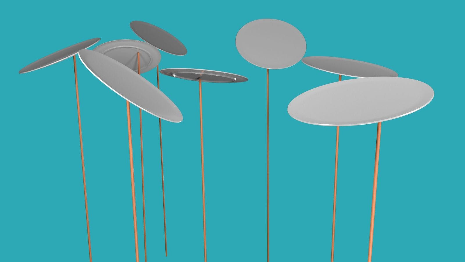 Plates being spun on thin wooden pikes against a teal background.