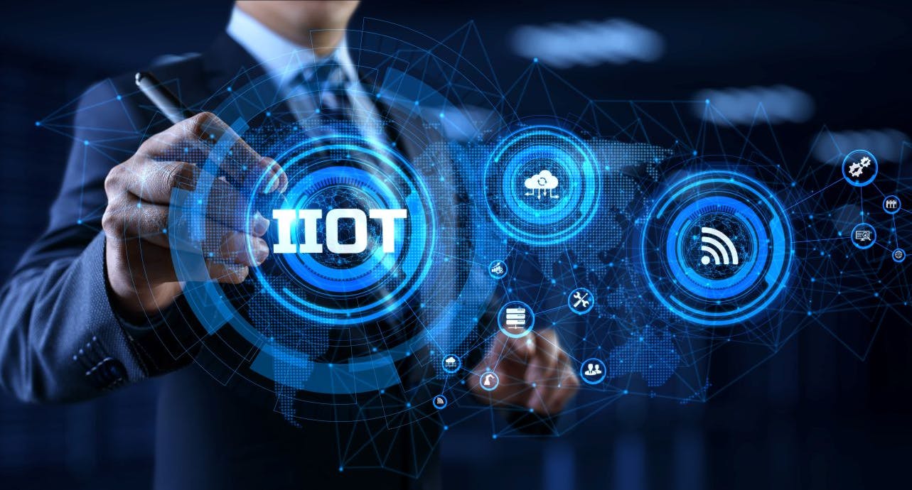 IIOT Industrial internet of things smart industry 4.0 technology concept. Businessman pressing virtual button.