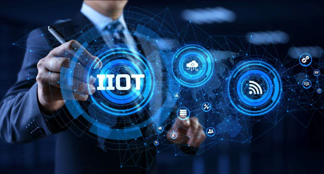 IIOT Industrial internet of things smart industry 4.0 technology concept. Businessman pressing virtual button.