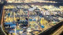 Aerial view of Zhejiang Petroleum & Chemical facility and the surrounding urban cityscape.