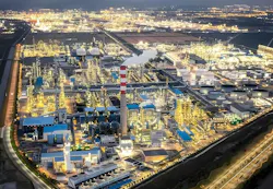Aerial view of Zhejiang Petroleum & Chemical facility and the surrounding urban cityscape.