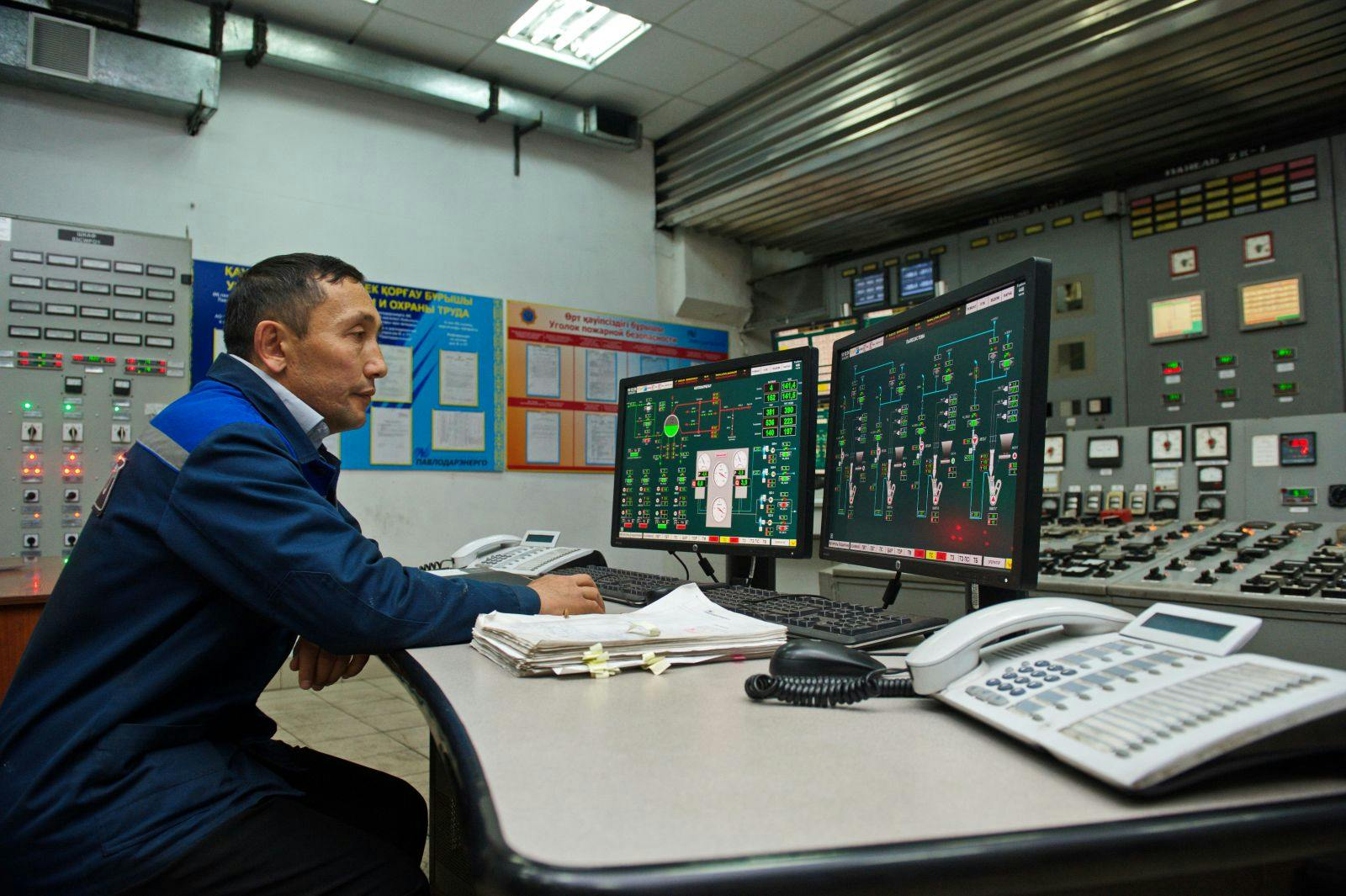 Engineers monitor the indicators in the central control point of the thermal power plant