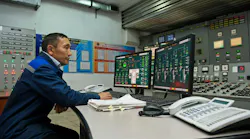 Engineers monitor the indicators in the central control point of the thermal power plant