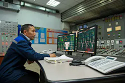 Engineers monitor the indicators in the central control point of the thermal power plant