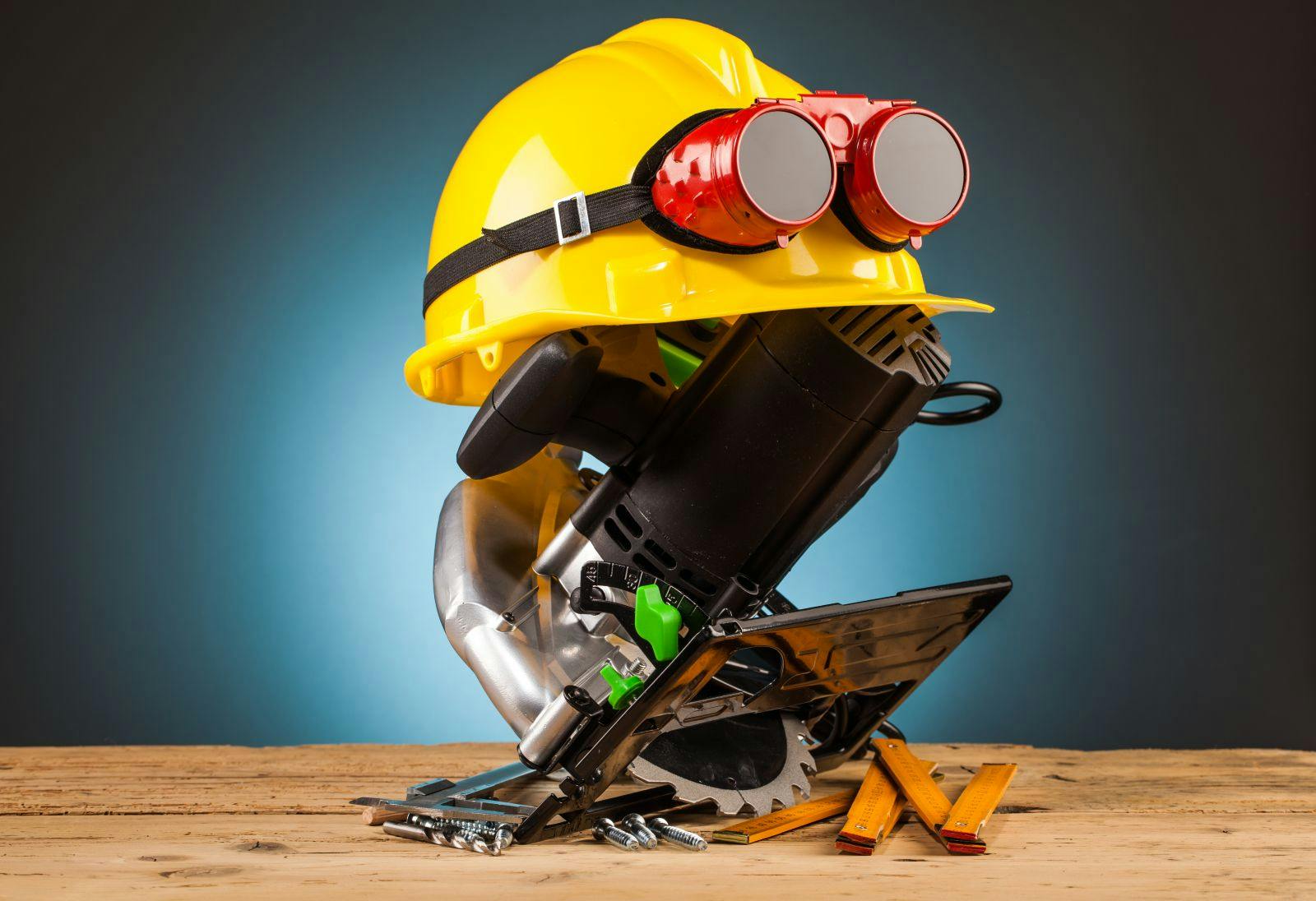 yellow helmet and wood mounting tools on wooden table