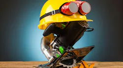 yellow helmet and wood mounting tools on wooden table