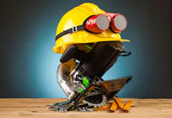 yellow helmet and wood mounting tools on wooden table