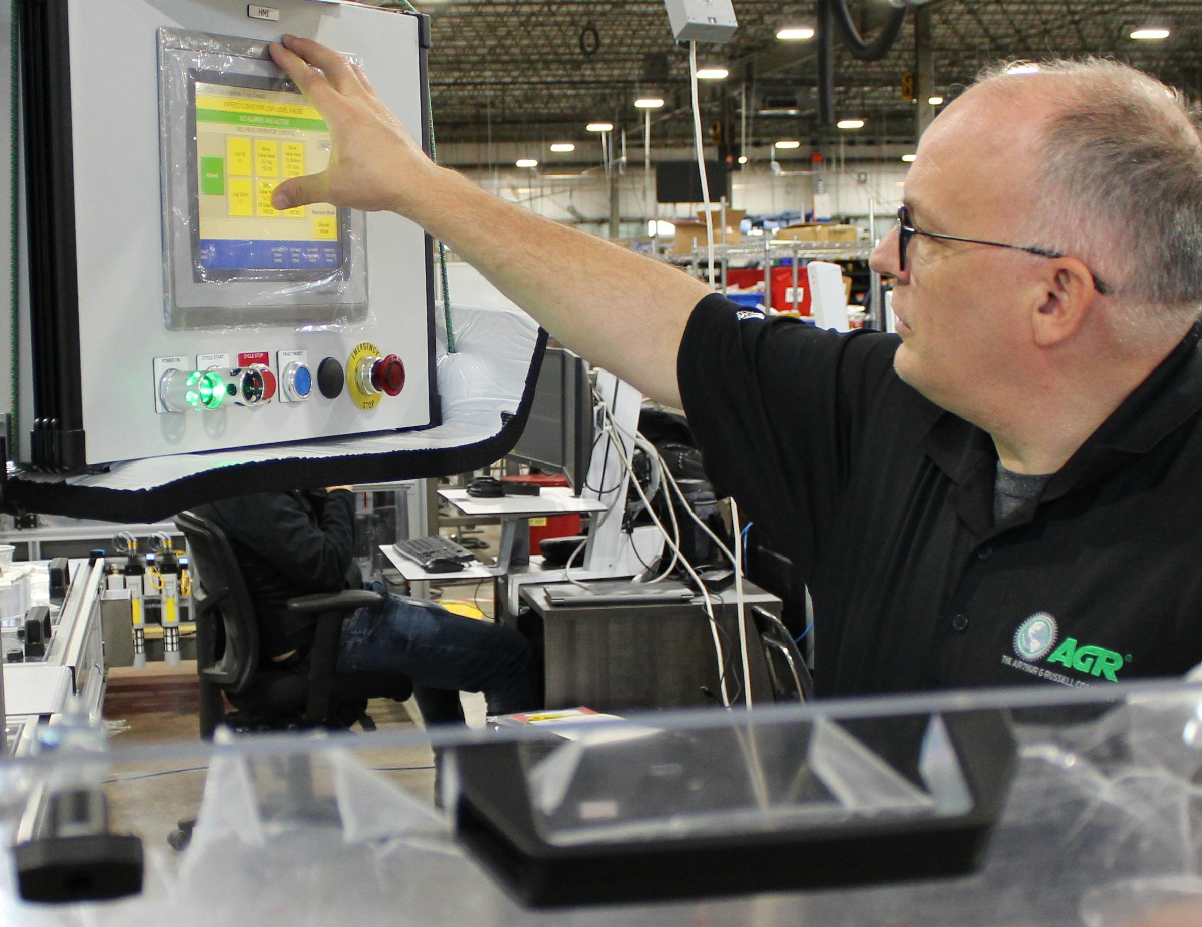 Bill Trotta-Smith, control systems engineer at Arthur G. Russell Co., adjusts a human-machine interface (HMI) on an automated system. AGR reports that he exemplifies the career longevity possible in manufacturing, where opportunities to learn, develop new skills and advance can lead to a lasting career. Source: Arthur G. Russell