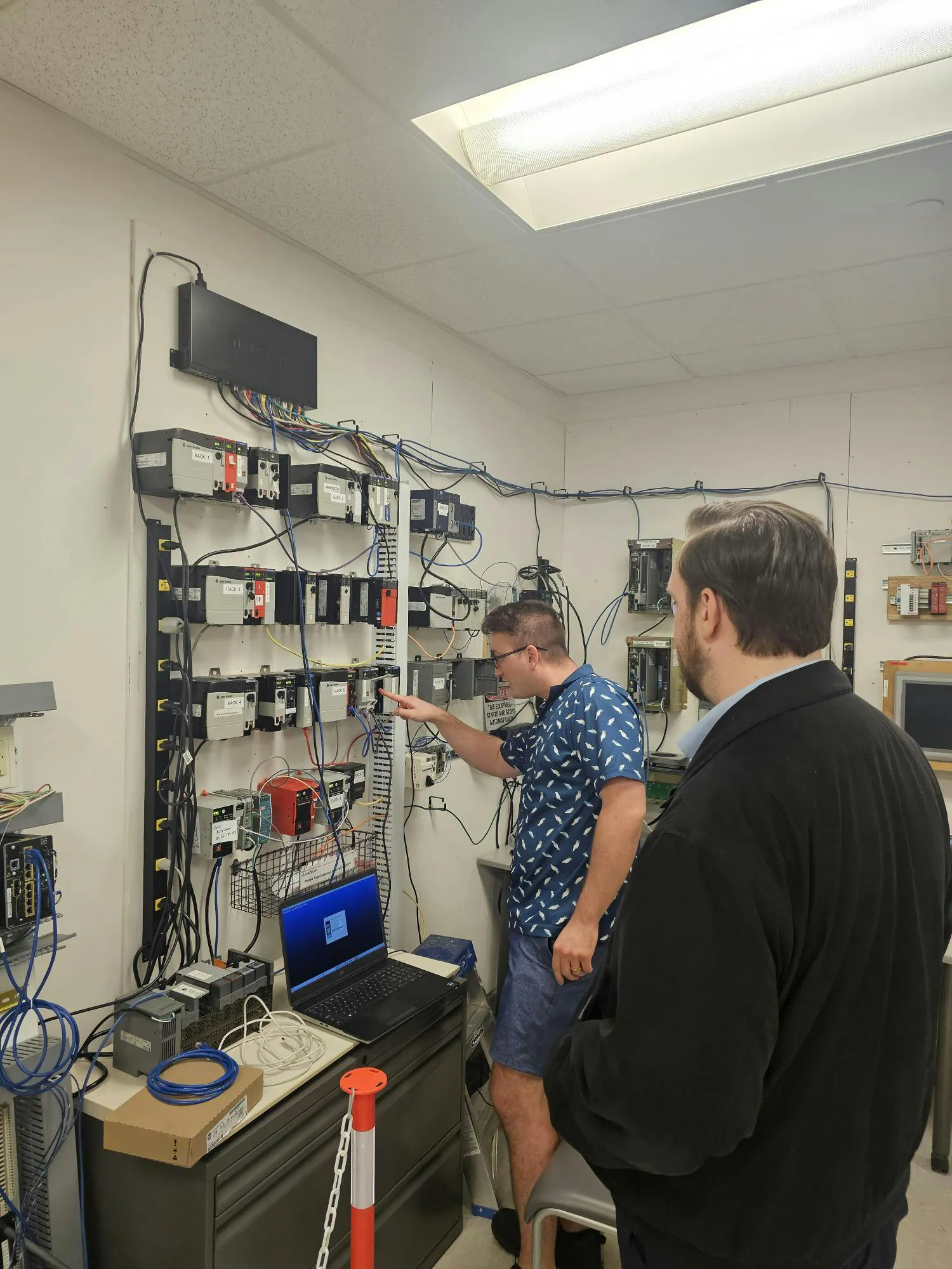 Figure 1: Matt Cioffi, project engineer at Actemium-Avanceon, explains the components and functionality of a PLC rack during a hands-on training session.