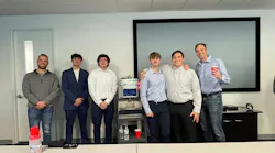 Figure 3: Nick Francone (far left), senior engineer, and Brian Fenn (far right), COO at Actemium-Avanceon, congratulate Penn State Berks students during their senior capstone project presentation of Bartendo. The students presented their engineering approach, design process and final system demonstration to the company’s team members.