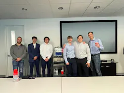 Figure 3: Nick Francone (far left), senior engineer, and Brian Fenn (far right), COO at Actemium-Avanceon, congratulate Penn State Berks students during their senior capstone project presentation of Bartendo. The students presented their engineering approach, design process and final system demonstration to the company’s team members.