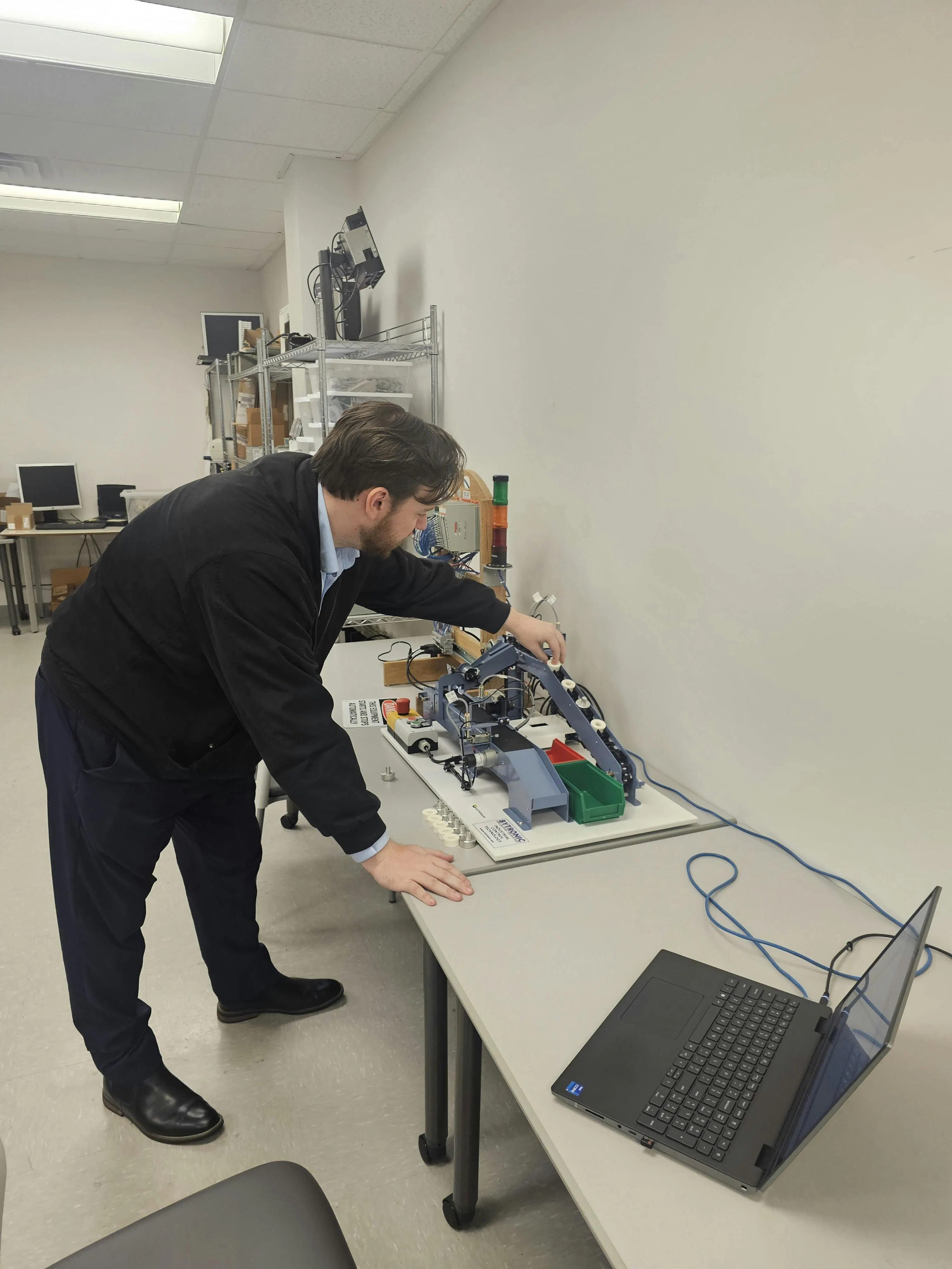 Figure 4: Michael Campbell, AI software engineer at Actemium-Avanceon, tests an AI-generated factory acceptance test (FAT) protocol using an inhouse training platform.