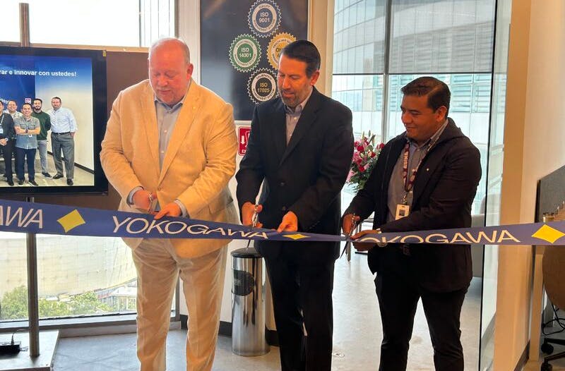Three Yokogawa officials cut the ribbon at the opening of the new Yokogawa de Mexico facility