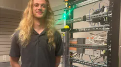 Figure 1: Jackson Prine, Next engineer at Eosys, demonstrates its proportional, integral, derivative (PID) trainer.