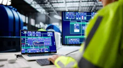 Female engineer manages oil and gas plant using AI technology on a laptop