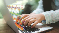 Hands typing on a laptop with holographic charts. Real-time analytics turn numbers into AI insights, powering forecasting and decisions. Modern workflow where algorithms and dashboards reveal trends