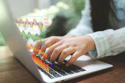 Hands typing on a laptop with holographic charts. Real-time analytics turn numbers into AI insights, powering forecasting and decisions. Modern workflow where algorithms and dashboards reveal trends